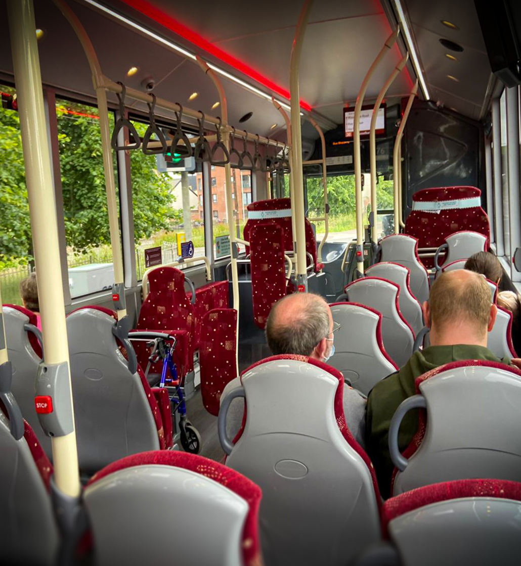 Image of the inside of a Lothian bus with passengers at their seats