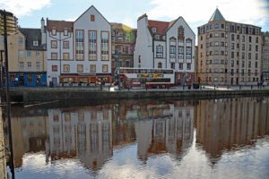 A Lothian city bus drives along Leith Shore.