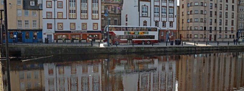 A Lothian city bus drives along Leith Shore.