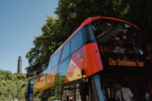 A red CitySightseeing Tour bus.