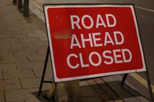 A road ahead closed sign.