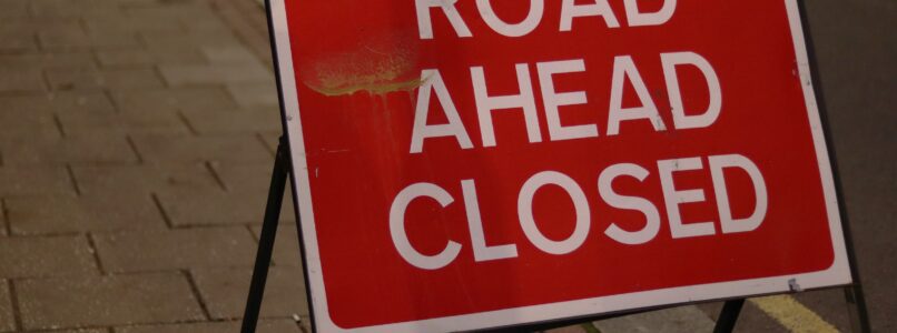 A road ahead closed sign.