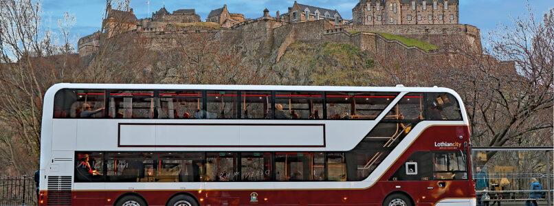Lothian bus on Princes Street in front of Edinburgh Castle.