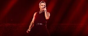 Robbie Williams on stage.