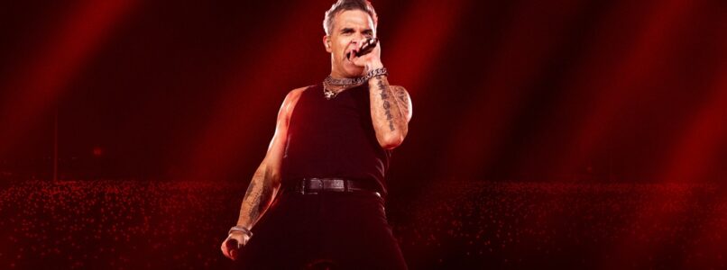 Robbie Williams on stage.