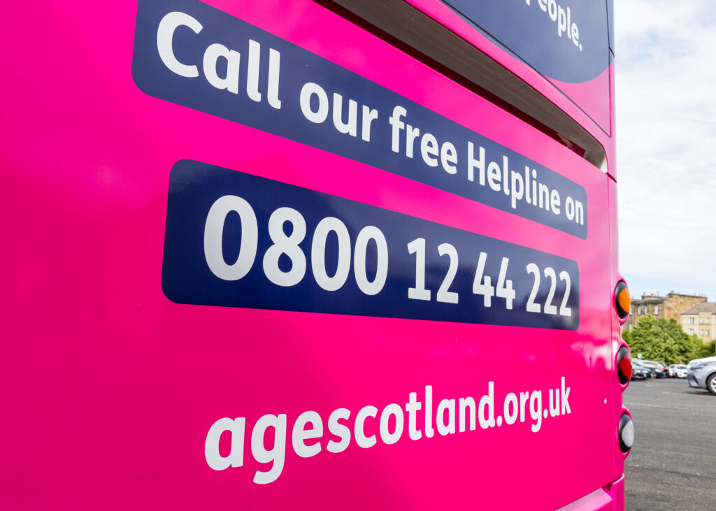 The rear of the charity bus which features the helpline information.