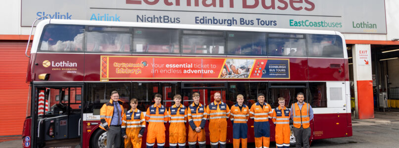 The new apprentice engineers alongside Dylan Dastey (Engineering Director) and Michael Taylor (Engineering Apprentice & Training Manager) in front of a double deck bus at Lothian's Central Garage.
