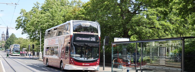 A Lothian bus at a bus stop on Princes Street.