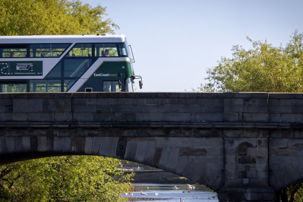 East Coast Bus driving over a bridge in East Lothian